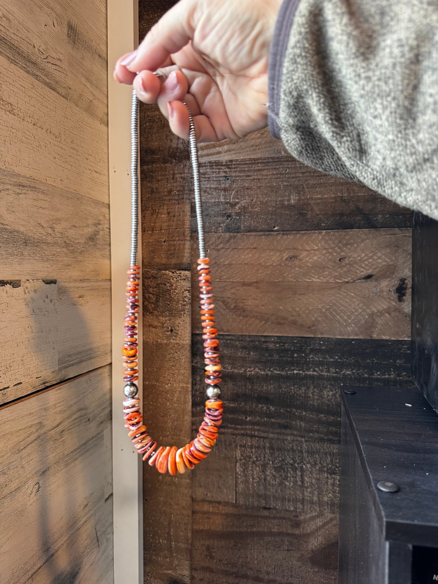 22 Inch graduated necklace orange and purple spiny and sterling silver pearls